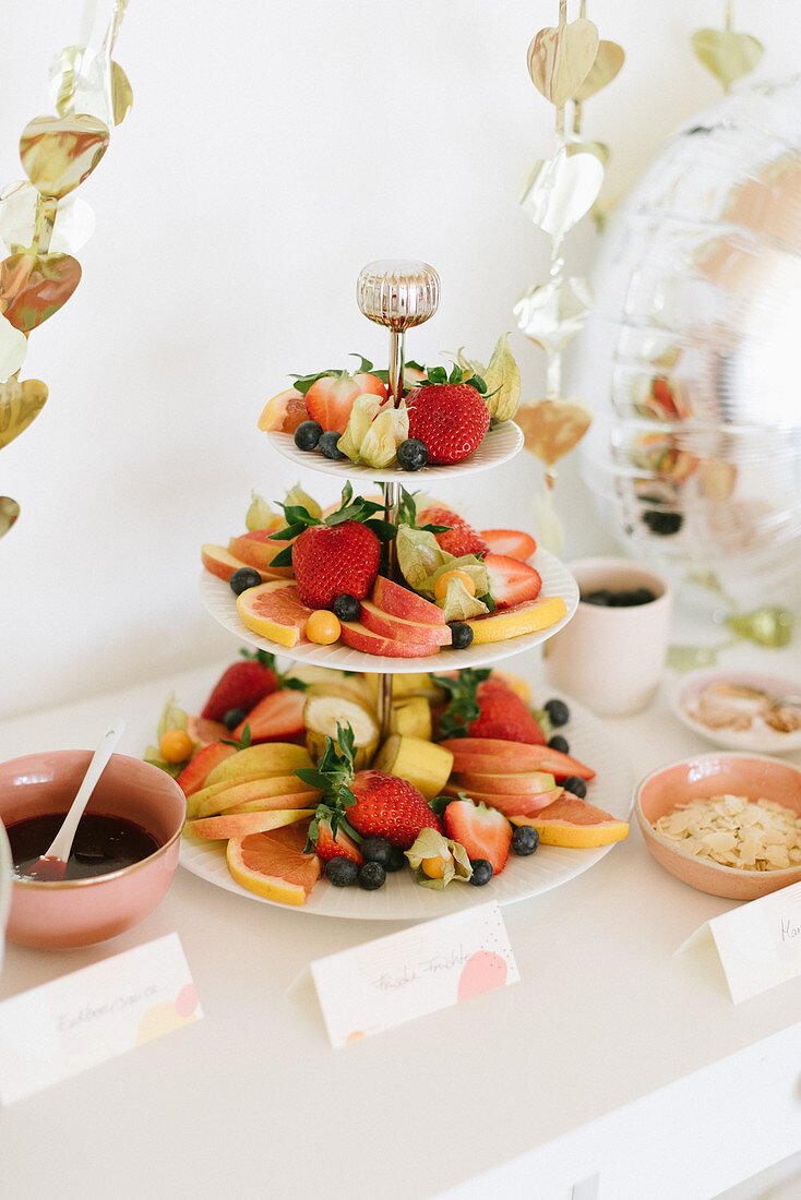 Fresh fruits on cake stand on party buffet table