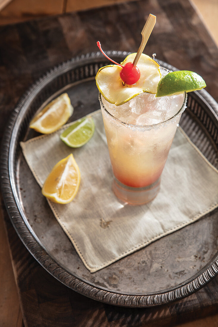 Apricot brandy Margarita garnished with candied apple slice