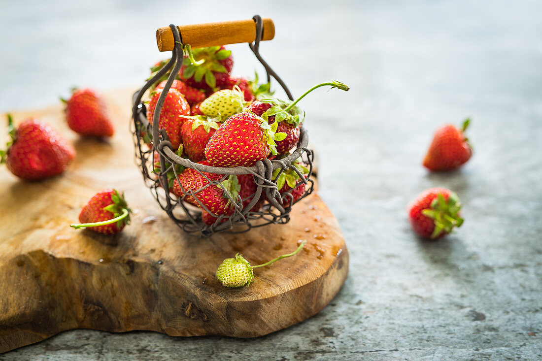 Fresh summer strawberries in a metal basket
