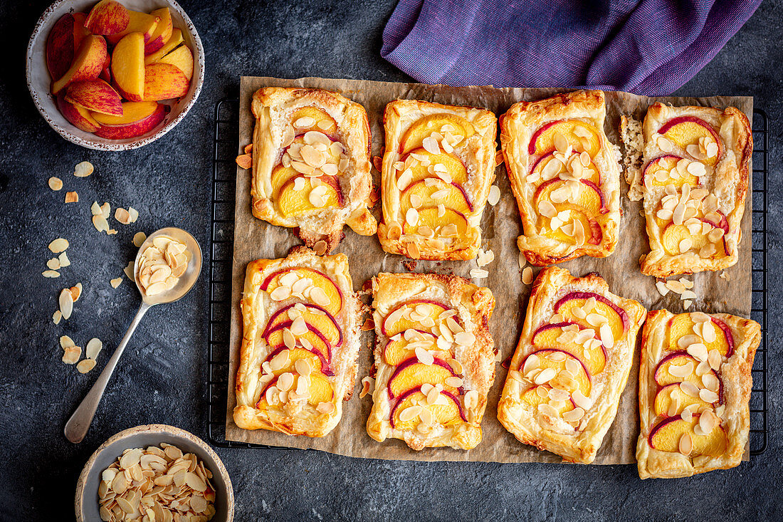 Puff pastry tarts with marzipan and peaches