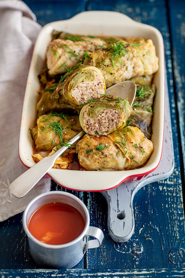 Cabbage leaves stuffed with meat and buckwheat, tomato sauce