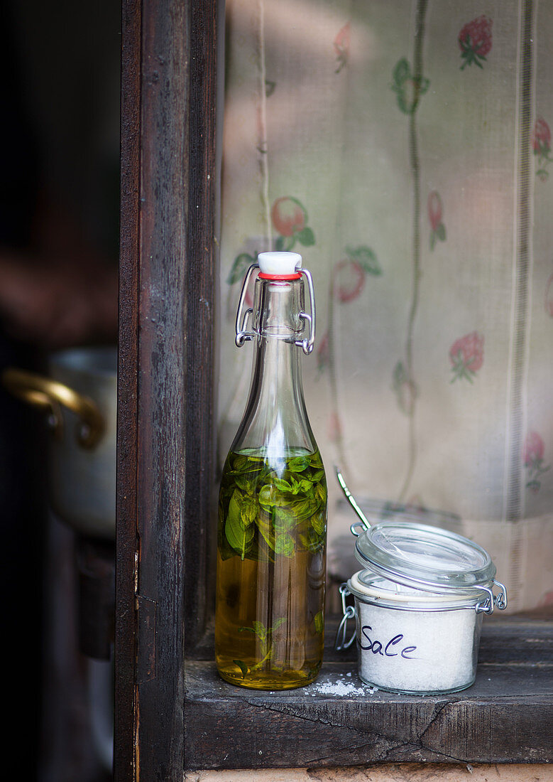 Basil oil and salt on a window sill