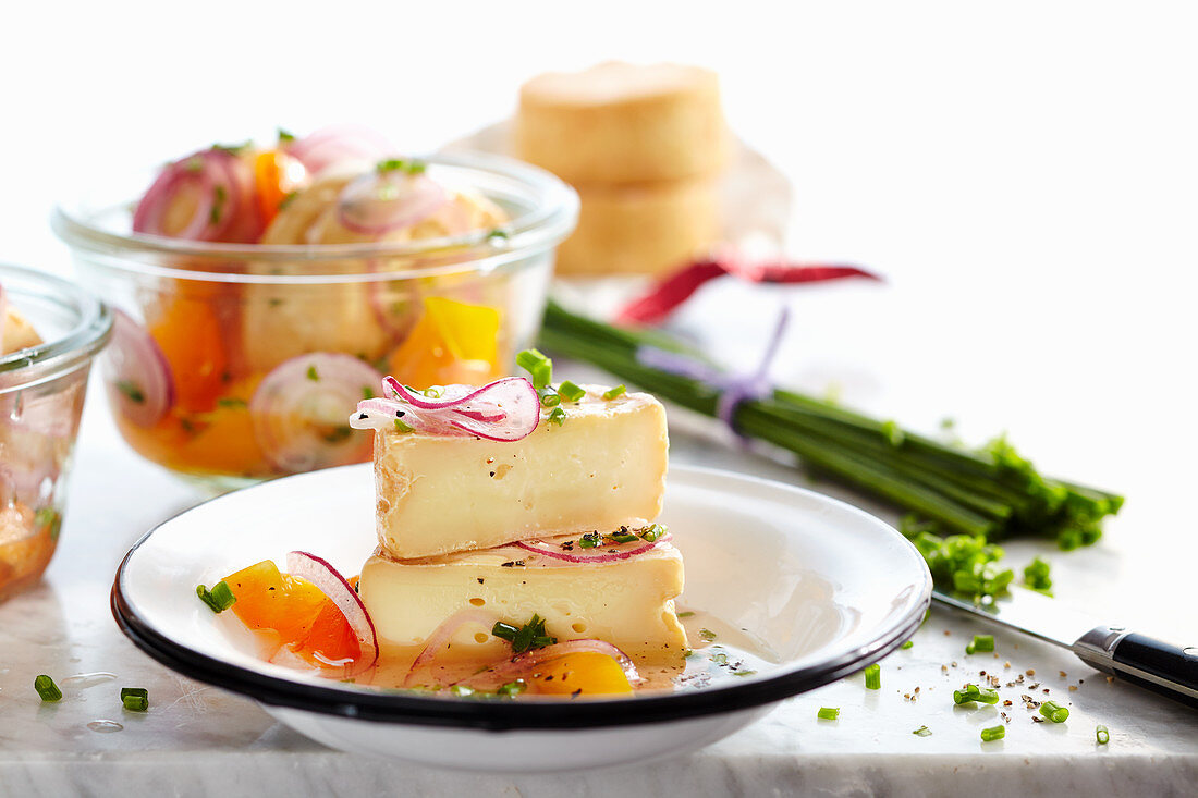 Marinated wine cheese with herbs and peppers