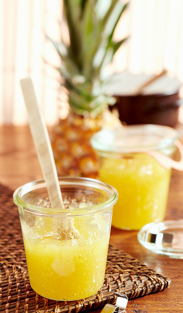 Jars of pineapple jam with coconut liqueur