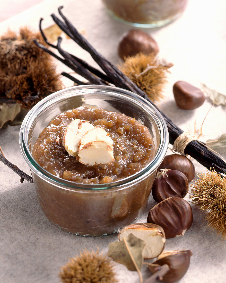 A jar of chestnut preserve with vanilla and chestnuts