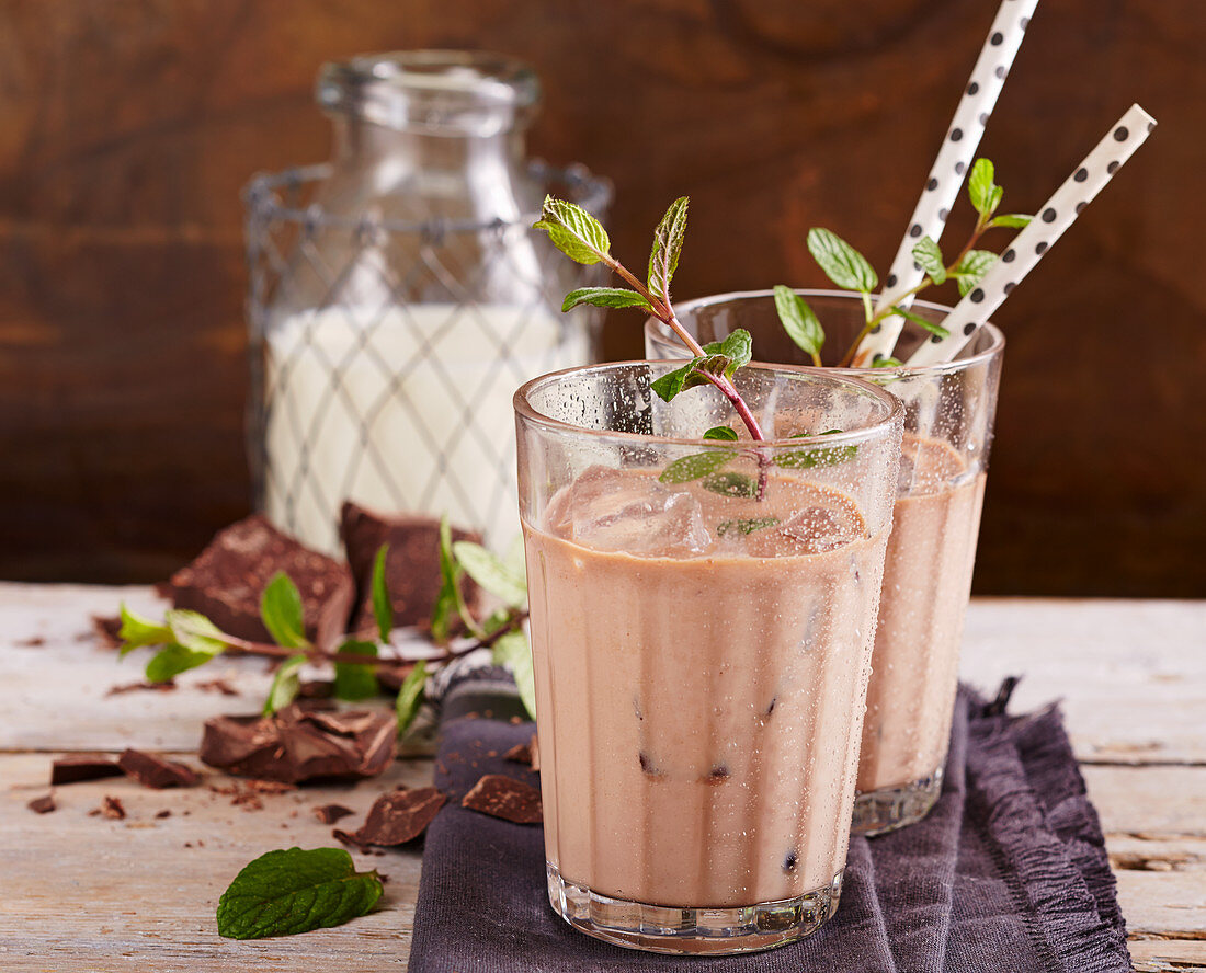 Chilled chocolate-mint milk in glasses with straws