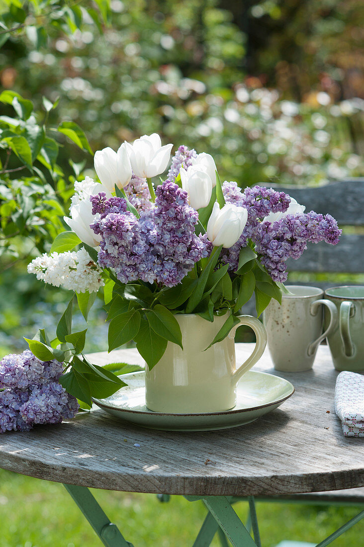 Bouquet of lilacs and white tulips