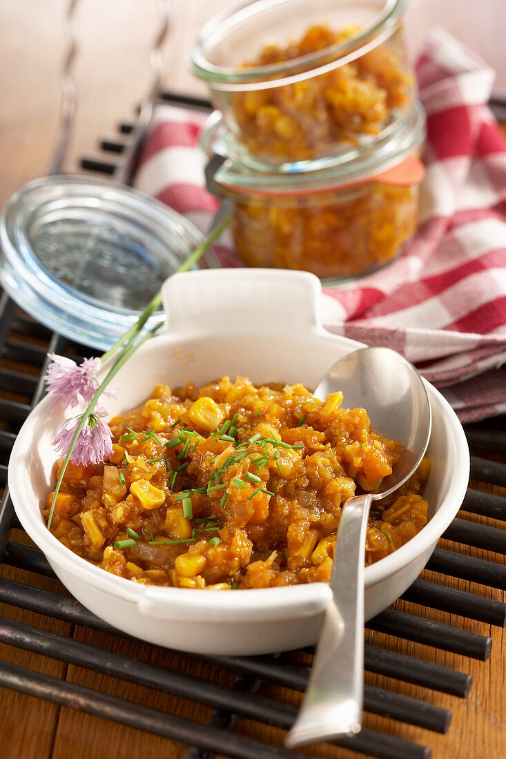 Spicy pumpkin relish in a dish and in jars