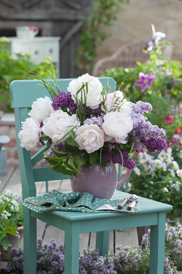 A bouquet of peonies and lilacs
