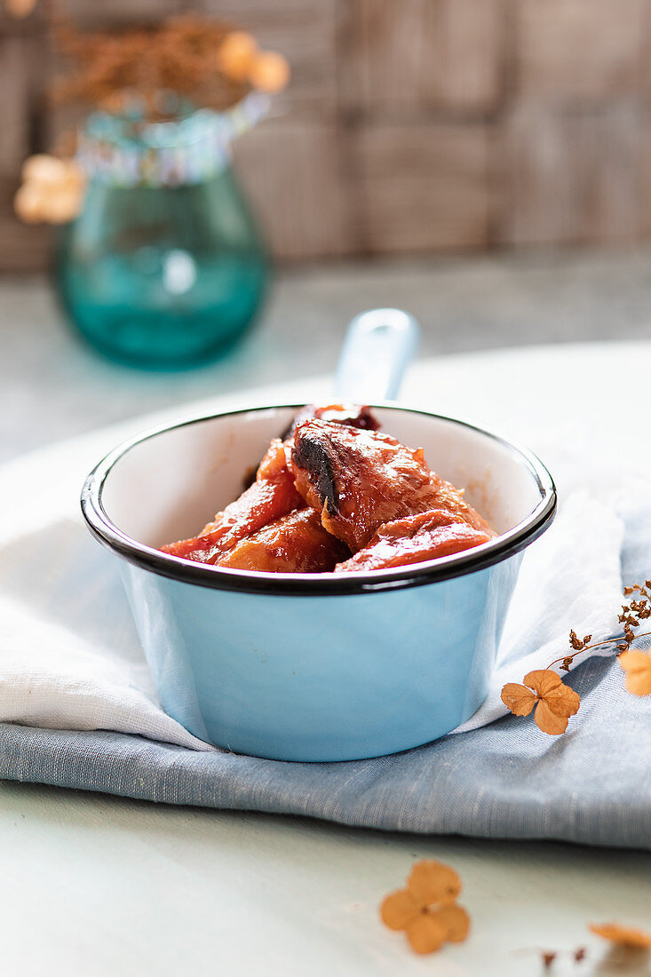 Roasted quince in an enamel pot