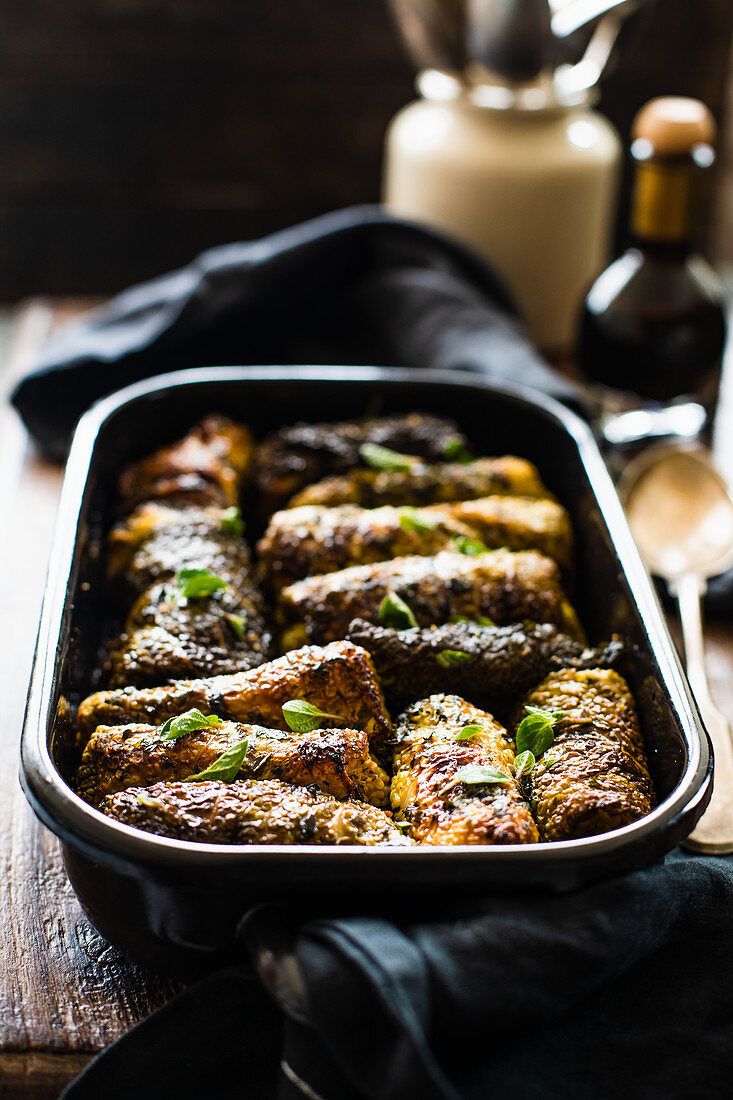 Savoy cabbage rolls in a roasting pan