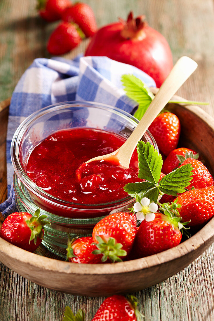 Pomegranate and strawberry jam with fresh fruit