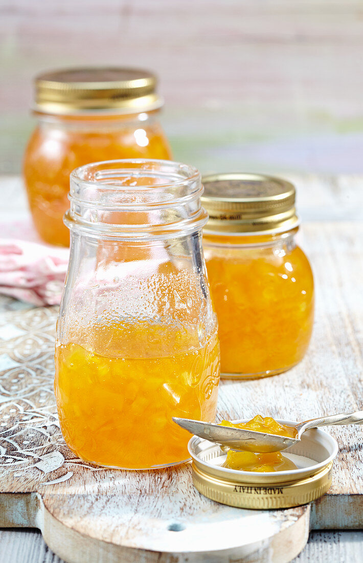 A jar of pineapple and mango jam with ginger