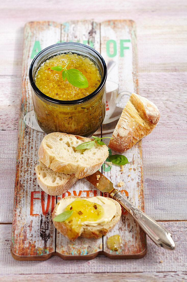 Courgette and pineapple jam in a jar and on a slice of white bread