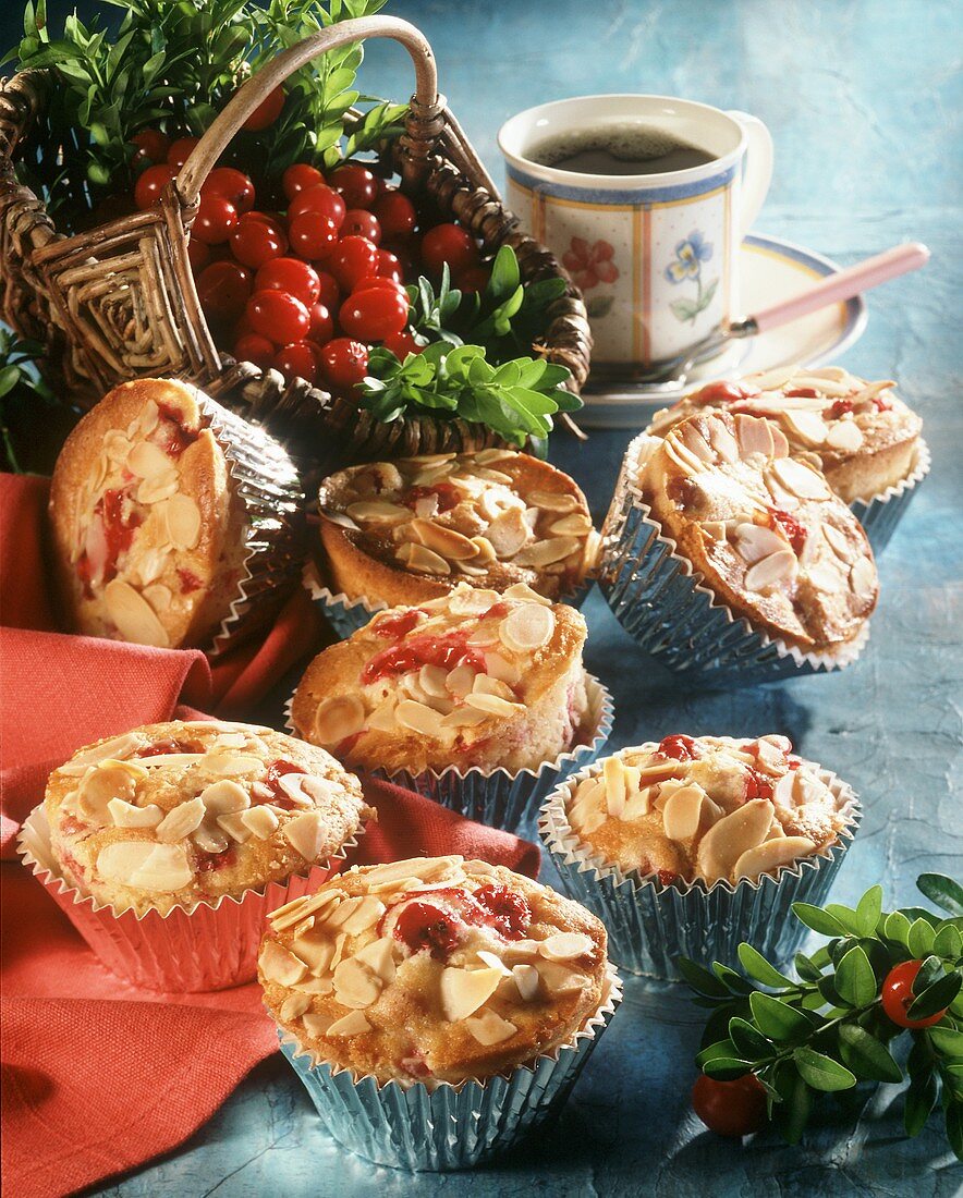 A few cranberry muffins with flaked almonds in cases