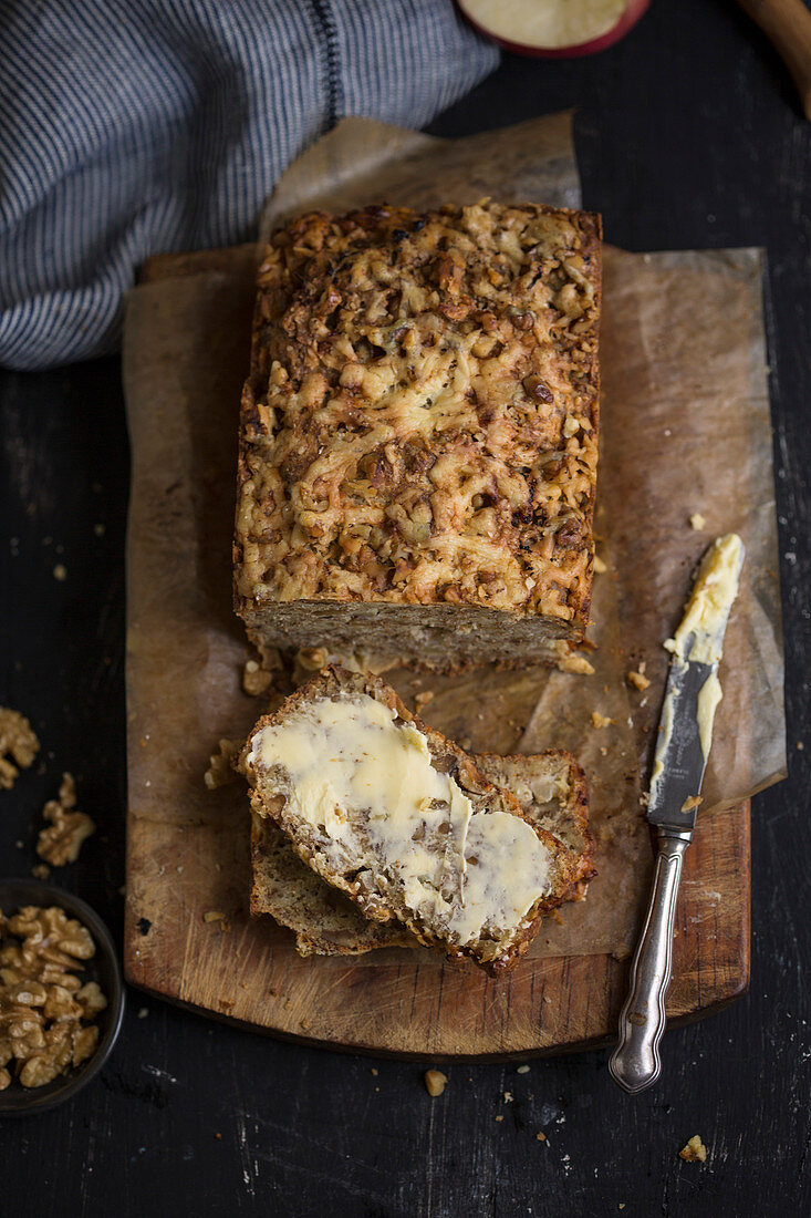 Rustic walnut bread with cheese and a slice of butter