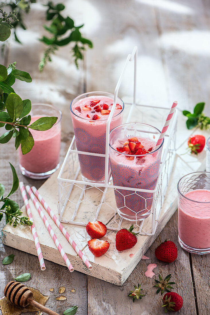 Strawberry drinking yoghurt in serving glasses in a shade