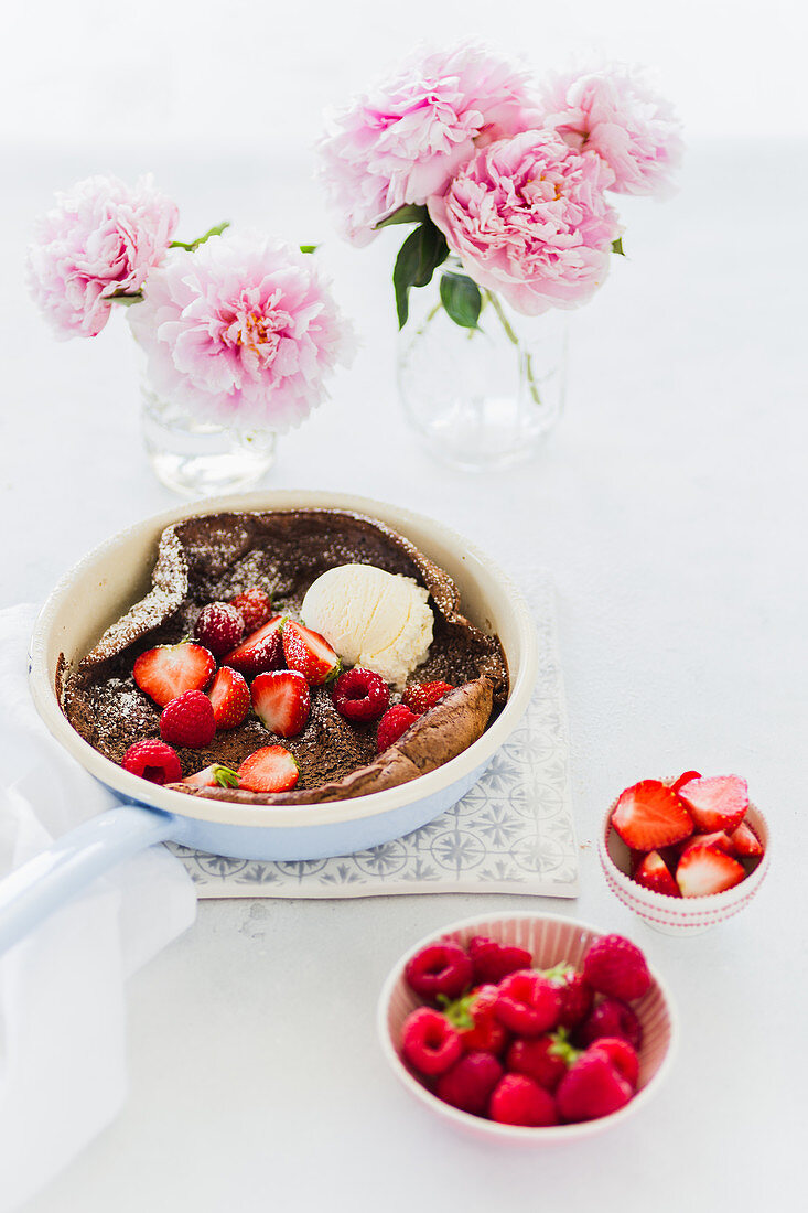 Chocolate omelette with berries and vanilla ice cream