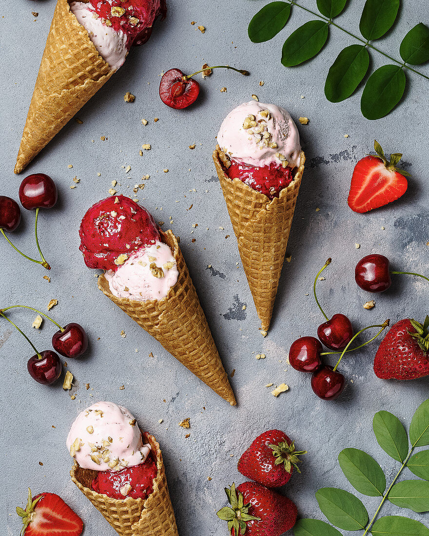 Strawberry and cherry ice-cream cones