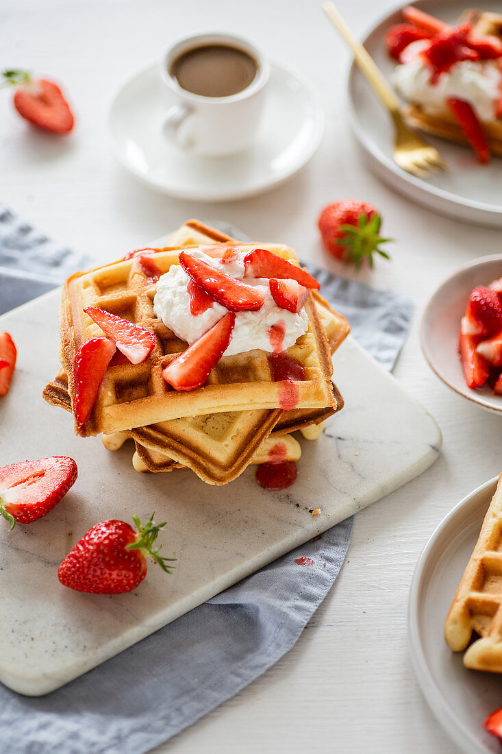 Yeast waffles with strawberries and cream