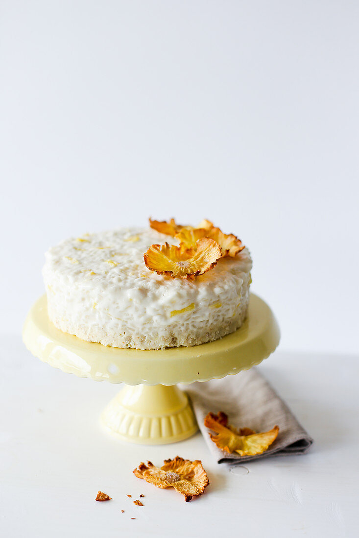 Rice pudding cake with pineapple on a cake stand