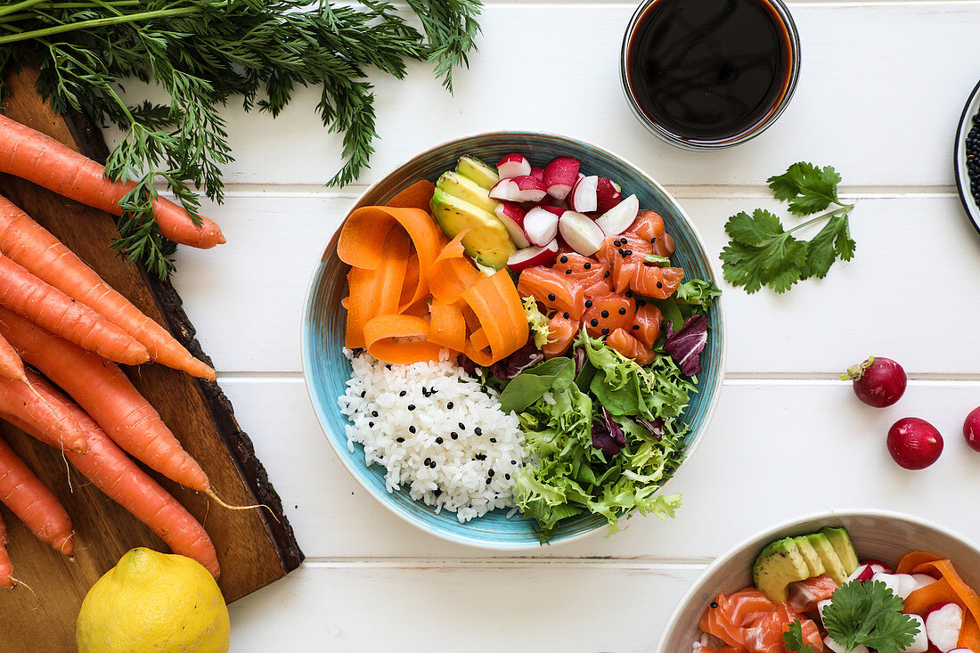 Bowl of yummy boiled rice with various fresh vegetables