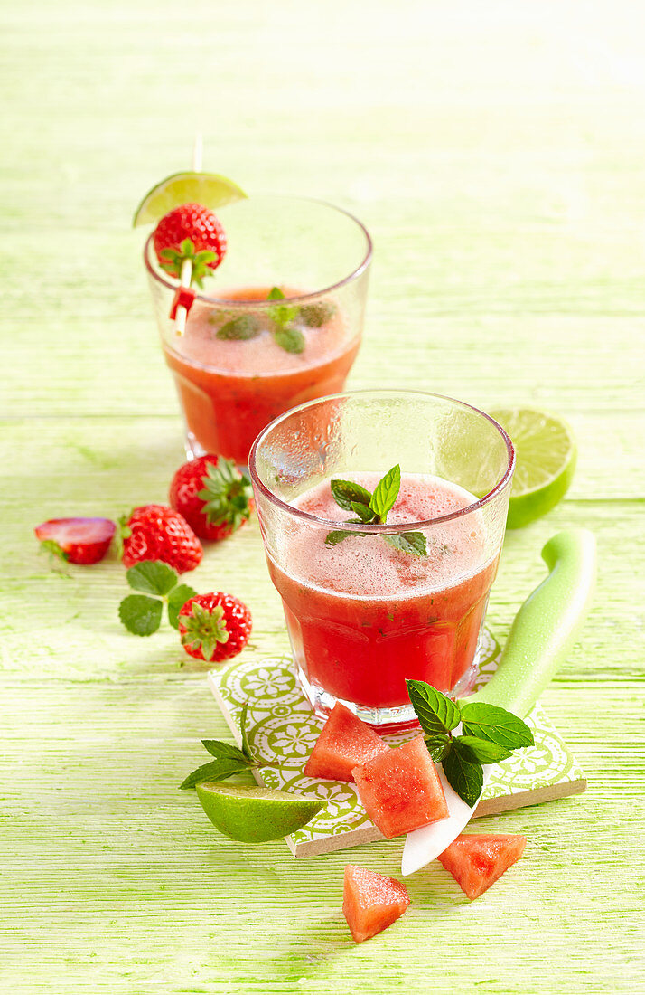 Frosted watermelon strawberry mojito with mint and lime