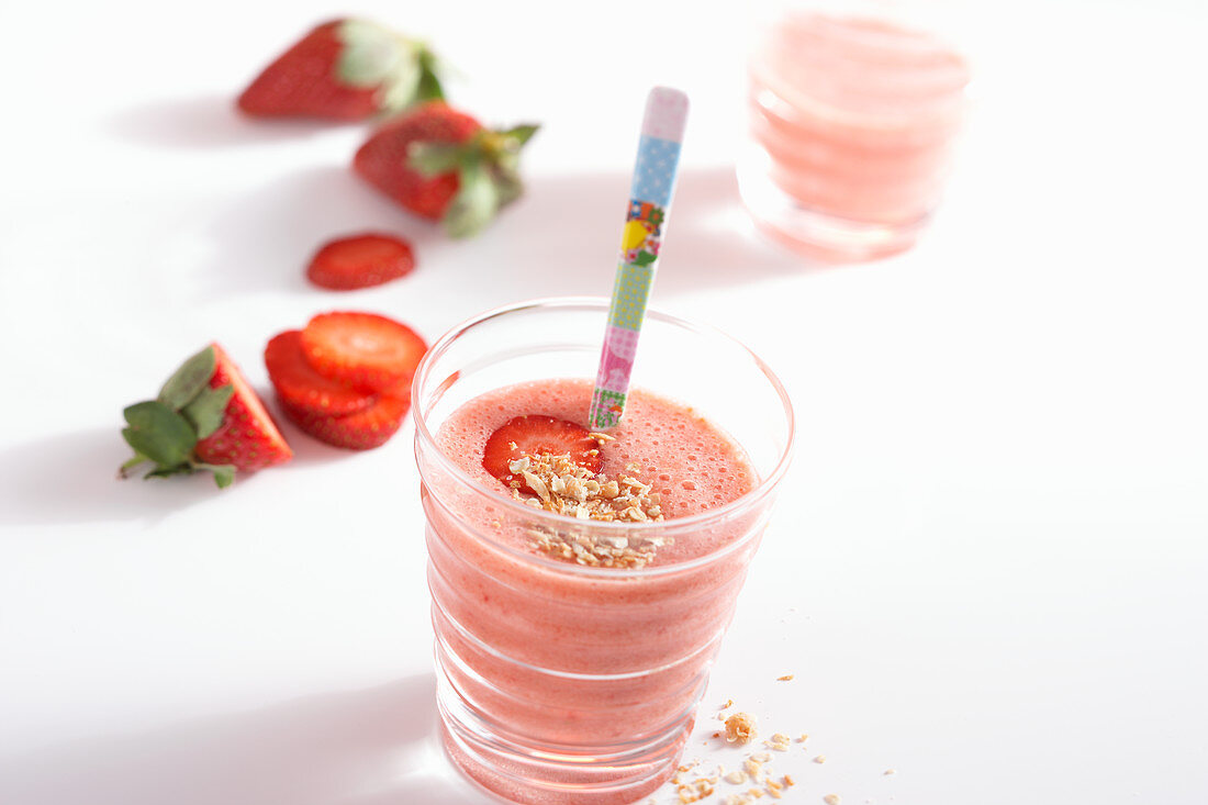 Strawberry and banana smoothie with honey, orange, oat and coconut
