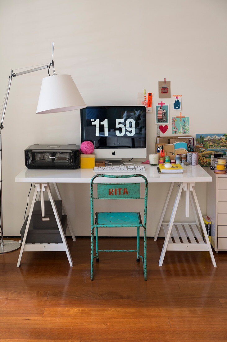 White trestle desk, vintage chair and standard lamp