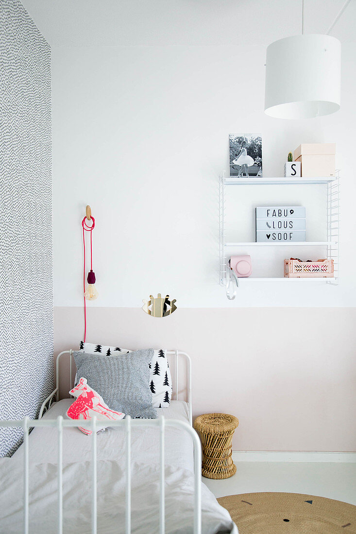 Metal bed against two-tone bed in child's bedroom