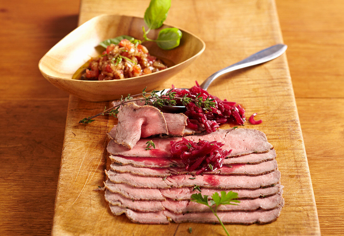 Sliced cold roast beef with tomato vinaigrette and onion confit