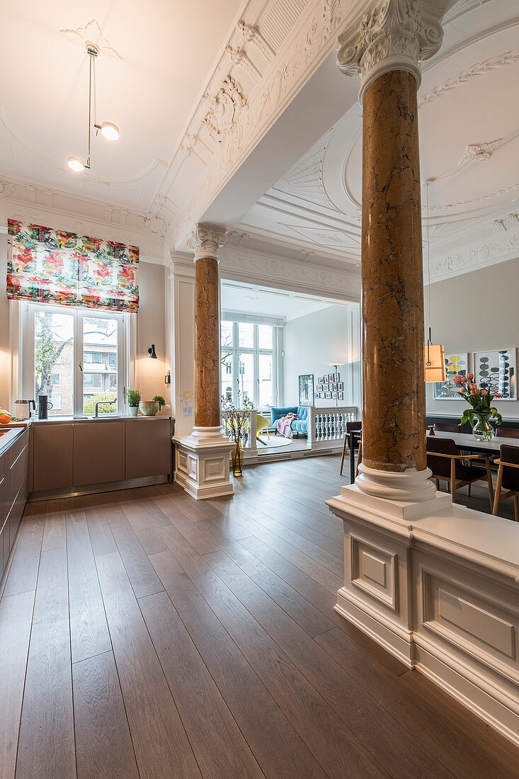 Open-plan interior with stucco and pillars in Wilhelmine-era villa