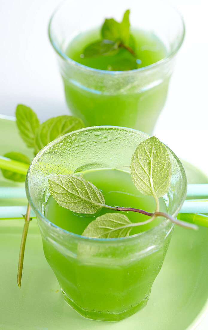 Green pineapple and mint lemonade in small glasses