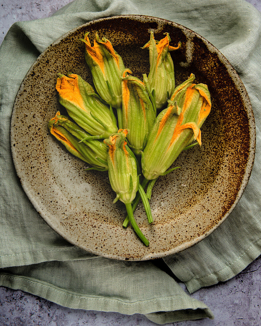 Zucchini flowers in a ceramic bowl