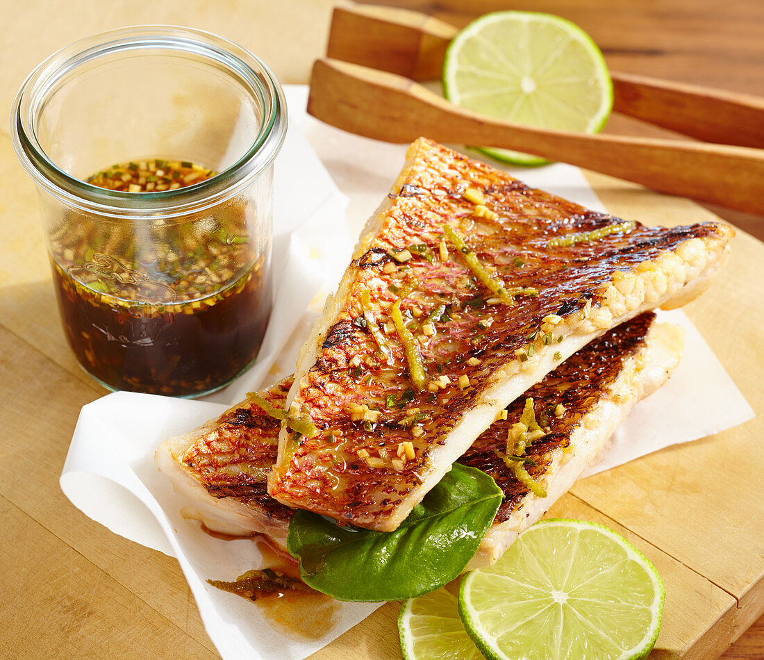 Grilled red snapper fillets in an oriental marinade with lime