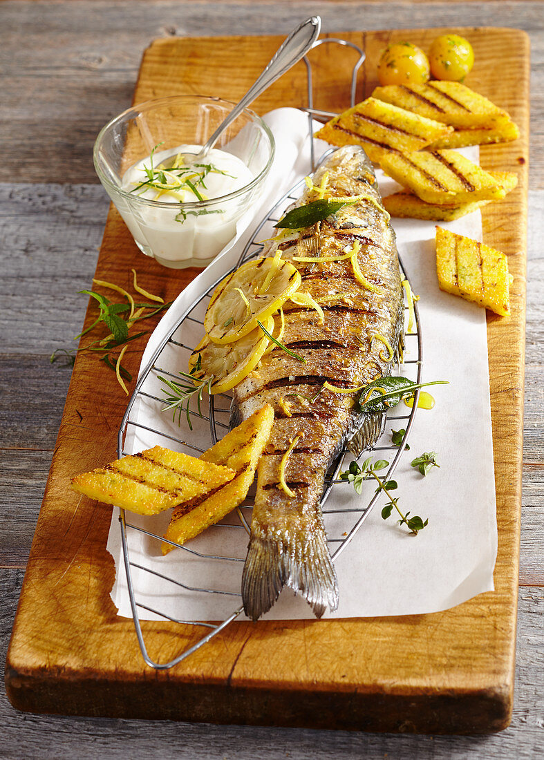 A whole grilled bass with polenta and lemon mayonnaise