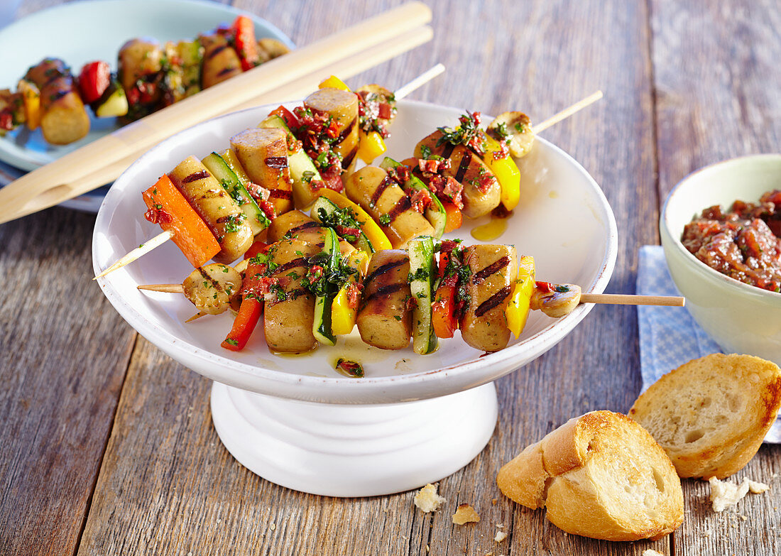 Grilled tofu sausage and vegetable skewers with white bread