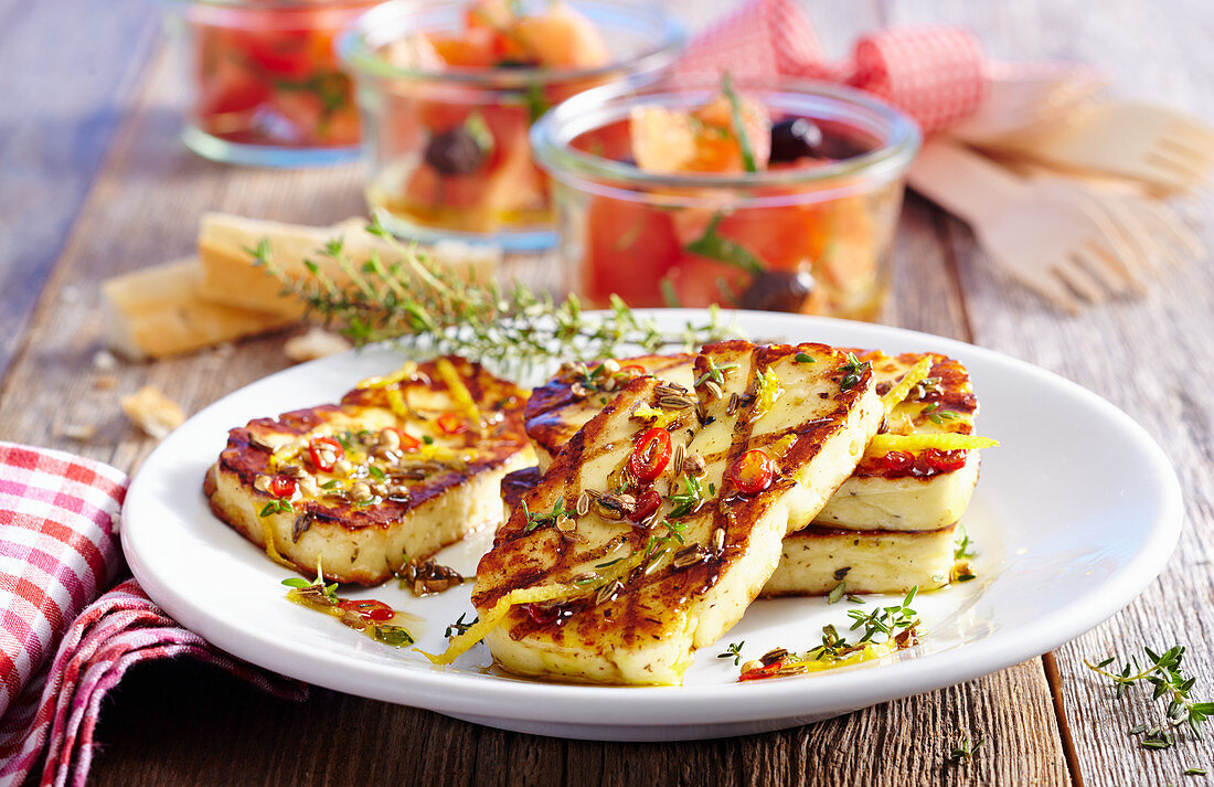 Grilled marinated halloumi with tomato salad