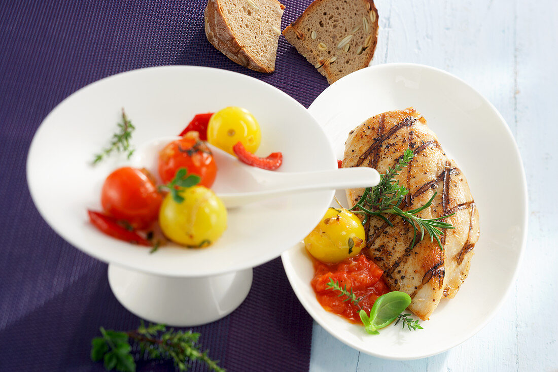Grilled, marinated chicken breast with braised tomatoes and sunflower-seed bread