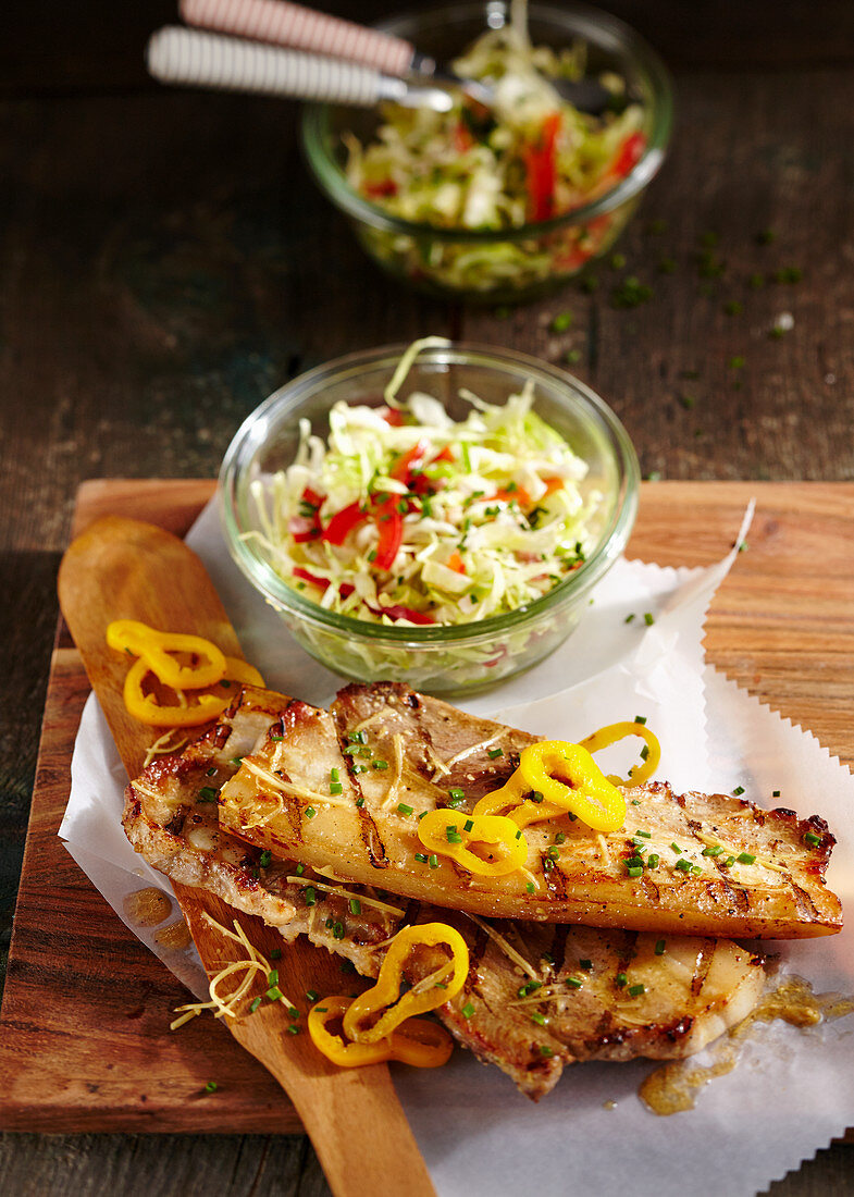 Grilled pork belly slices in a beer and horseradish marinade with coleslaw