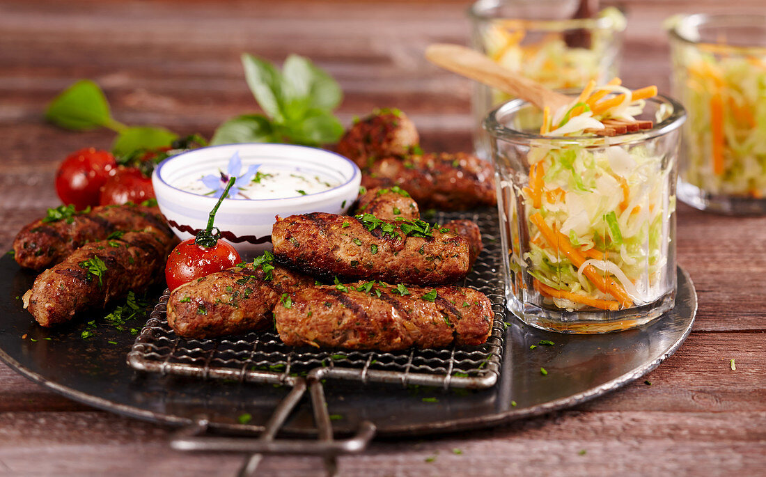 Grilled beef cevapcici with coleslaw and a yoghurt and garlic sauce