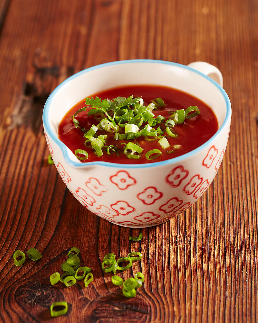 Sweet and sour fondue sauce with spring onions, ketchup, vinegar and ginger