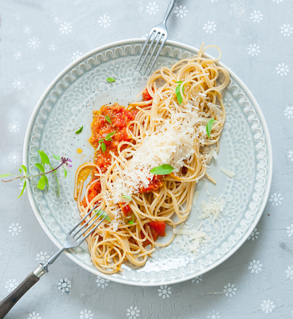 Spaghetti with spelt bolognese and Parmesan cheese