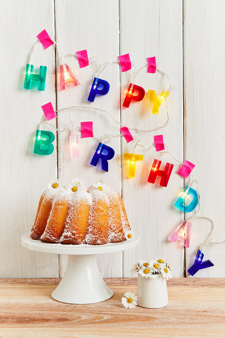 Lemon Bundt cake decorated with daises for a birthday