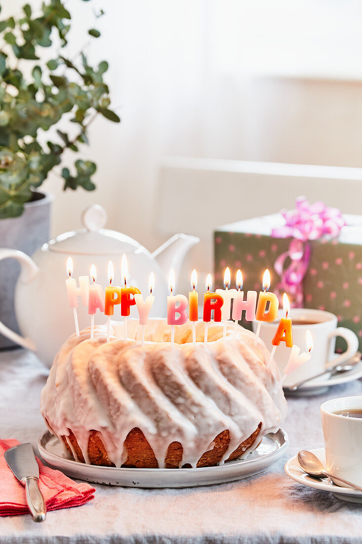A lemon Bundt cake with birthday candles