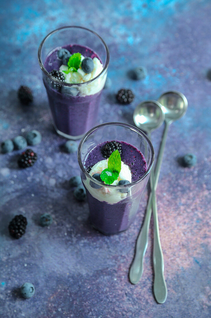 Blackberry and blueberry smoothie with ice cream and fresh mint