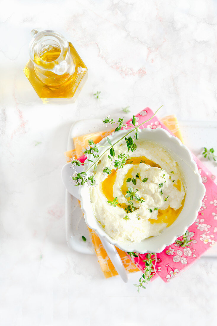 Feta cheese with olive oil and aromatics herbs