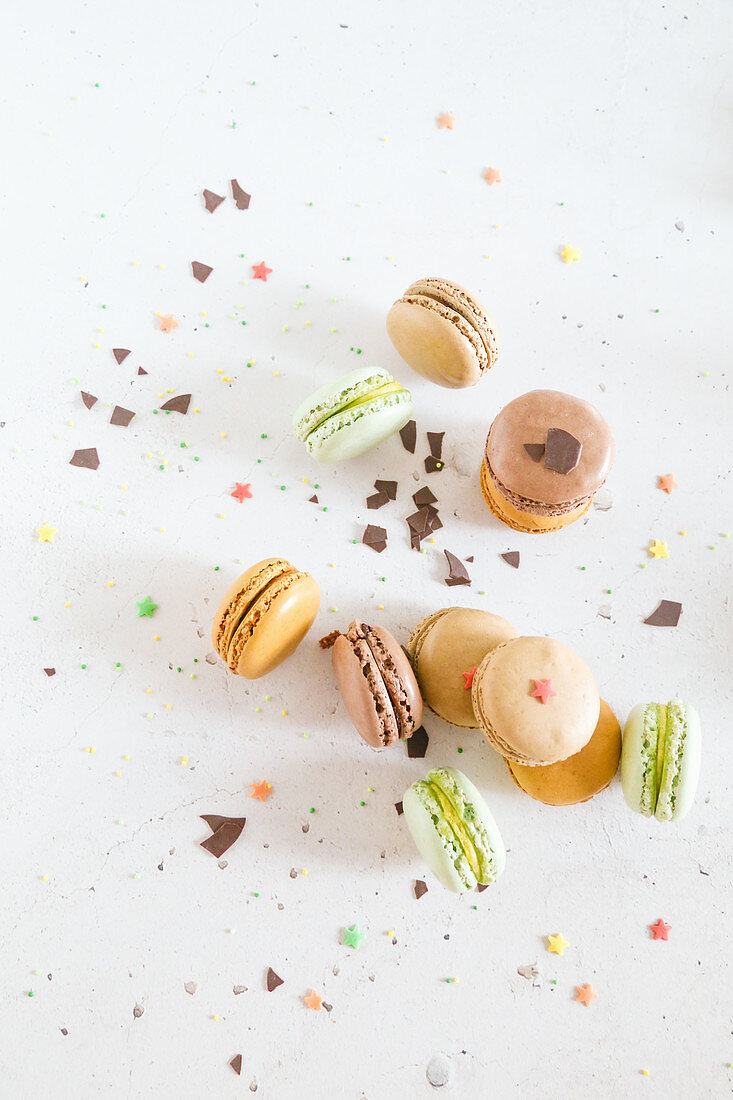 Mixed macarons with colorful sugars and chocolate chips