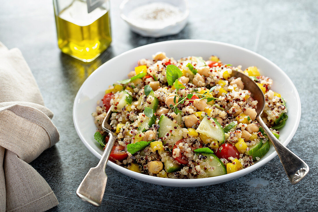 Fresh quinoa tabbouleh salad with tomatoes and cucumbers