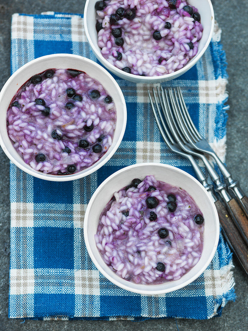 Blueberry risotto in porcelain bowls